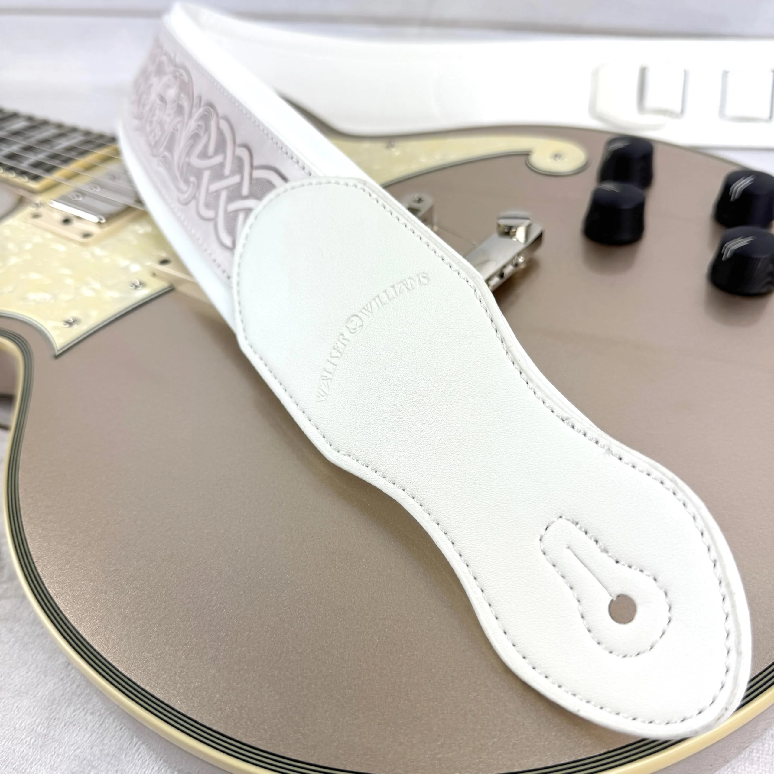 Walker And Williams KB-05-WHT Aged White Celtic Knot Full Grain Carving Leather Padded Strap With Arctic White garment leather Backing For Acoustic, Electric, And Bass Guitars - Image 4