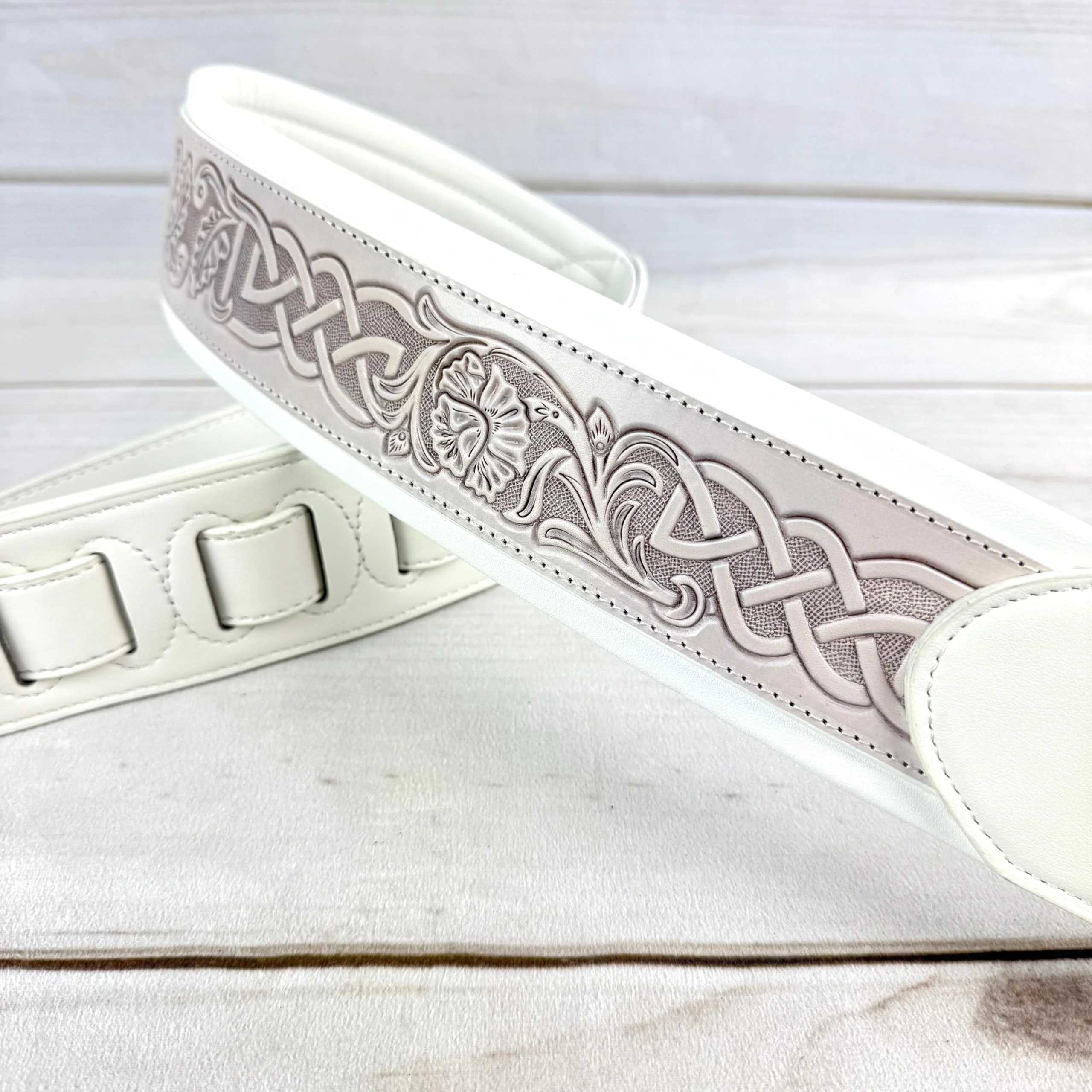 Walker And Williams KB-05-WHT Aged White Celtic Knot Full Grain Carving Leather Padded Strap With Arctic White garment leather Backing For Acoustic, Electric, And Bass Guitars - Image 6