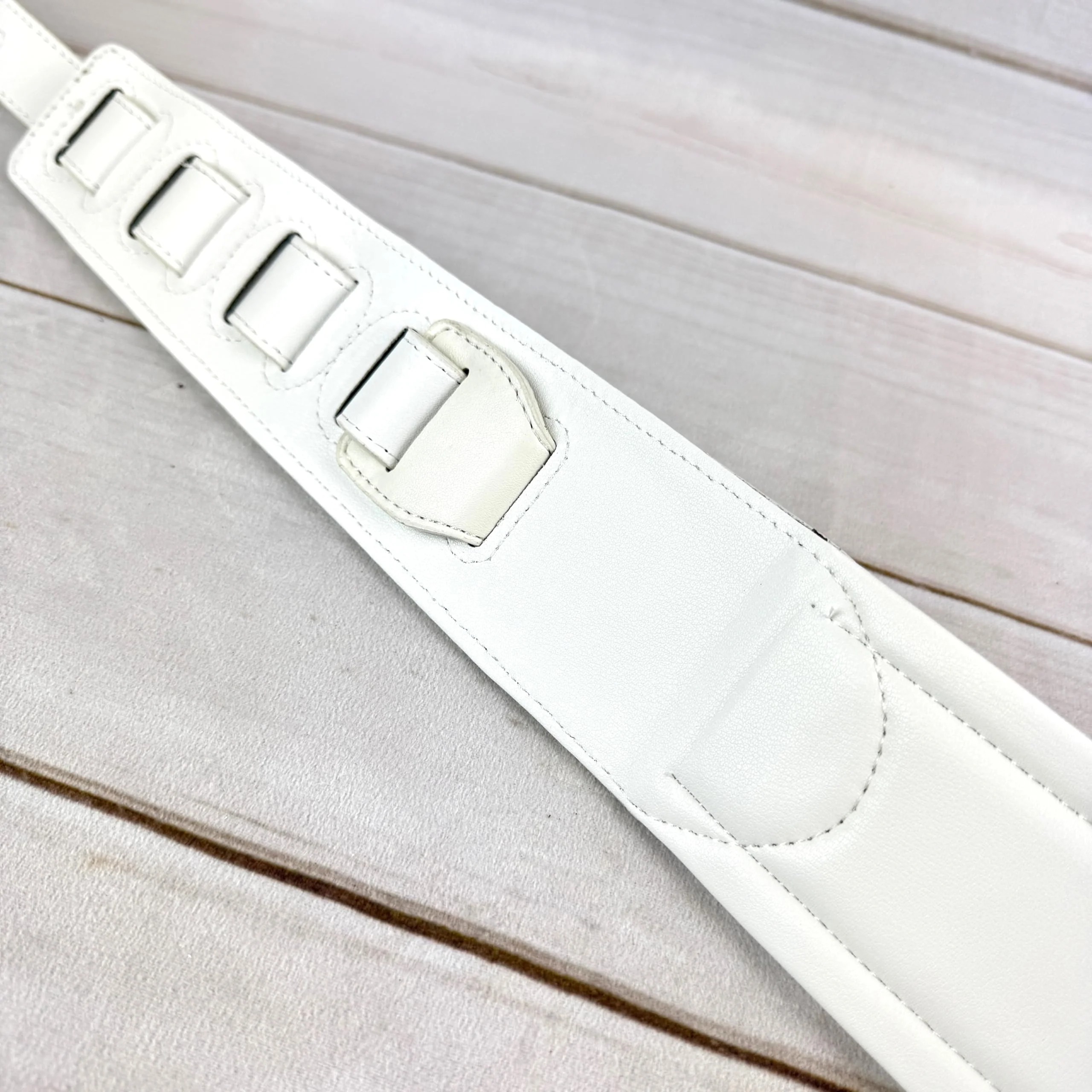 Walker And Williams KB-05-WHT Aged White Celtic Knot Full Grain Carving Leather Padded Strap With Arctic White garment leather Backing For Acoustic, Electric, And Bass Guitars - Image 9
