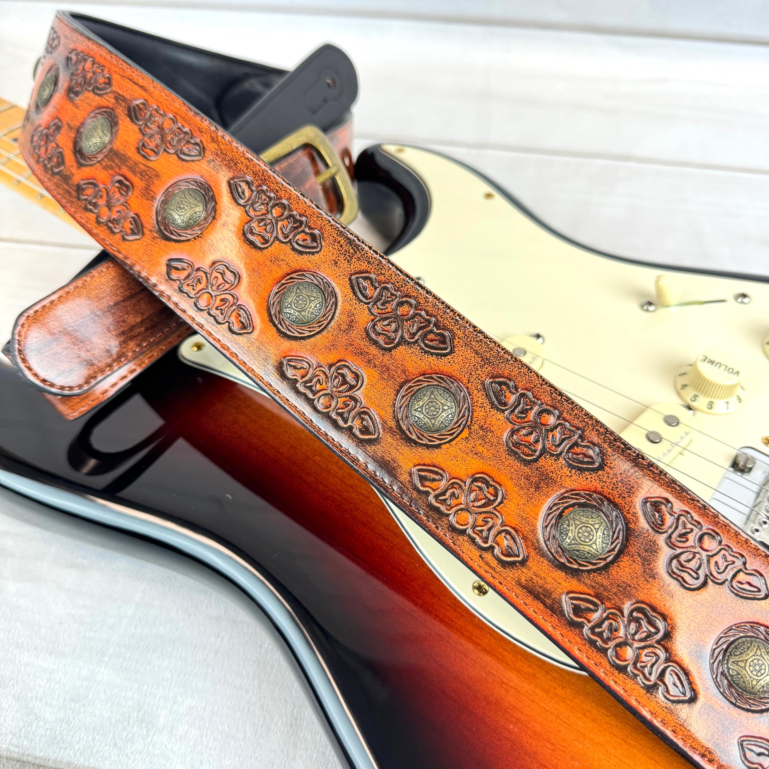 Walker & Williams GE-202 Antique Amber Tan Padded Guitar Strap with Brass Coin Studs, Brass Buckle, And Celtic Tooling For Acoustic, Electric, And Bass Guitars - Image 4