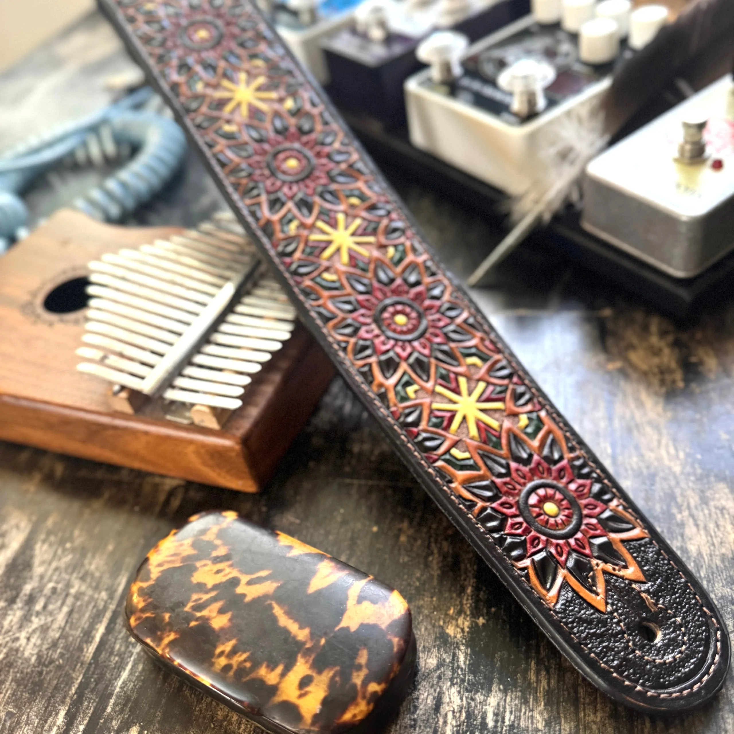 Walker & Williams LIH-2 Black And Brown Hand Carved Premium Leather Guitar Strap With Gold Earth Zodiac Star Design And Premium Padded Back For Acoustic, Electric, And Bass Guitars - Image 2