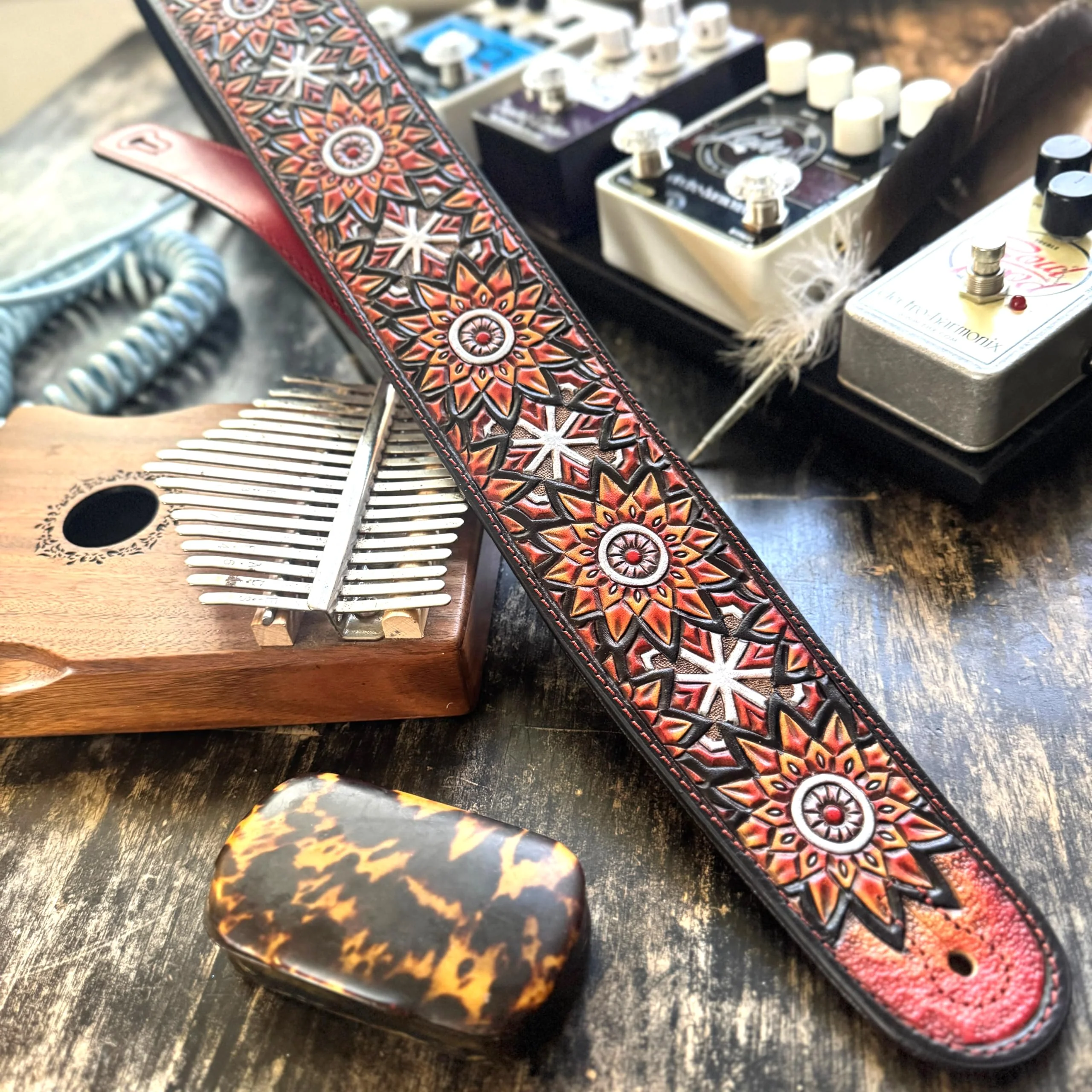 Walker & Williams LIH-3 Cherry Burst Red Hand Carved Premium Leather Guitar Strap With Black Zodiac Star Design And Premium Padded Leather Back For Acoustic, Electric, And Bass Guitars - Image 2